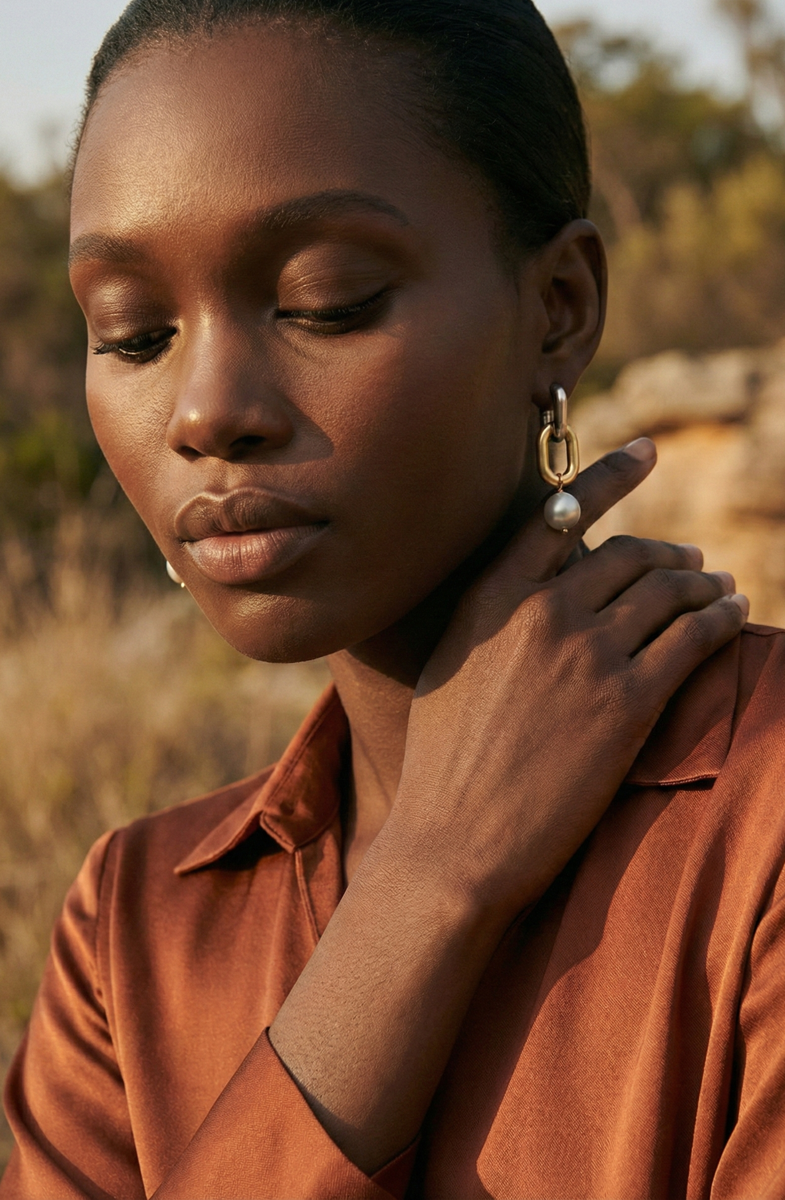 model wearing pearl earrings on a paris balcony
