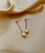 boucles d'oreilles pendantes en perles baroques roses sur une chaîne en or, style parisien