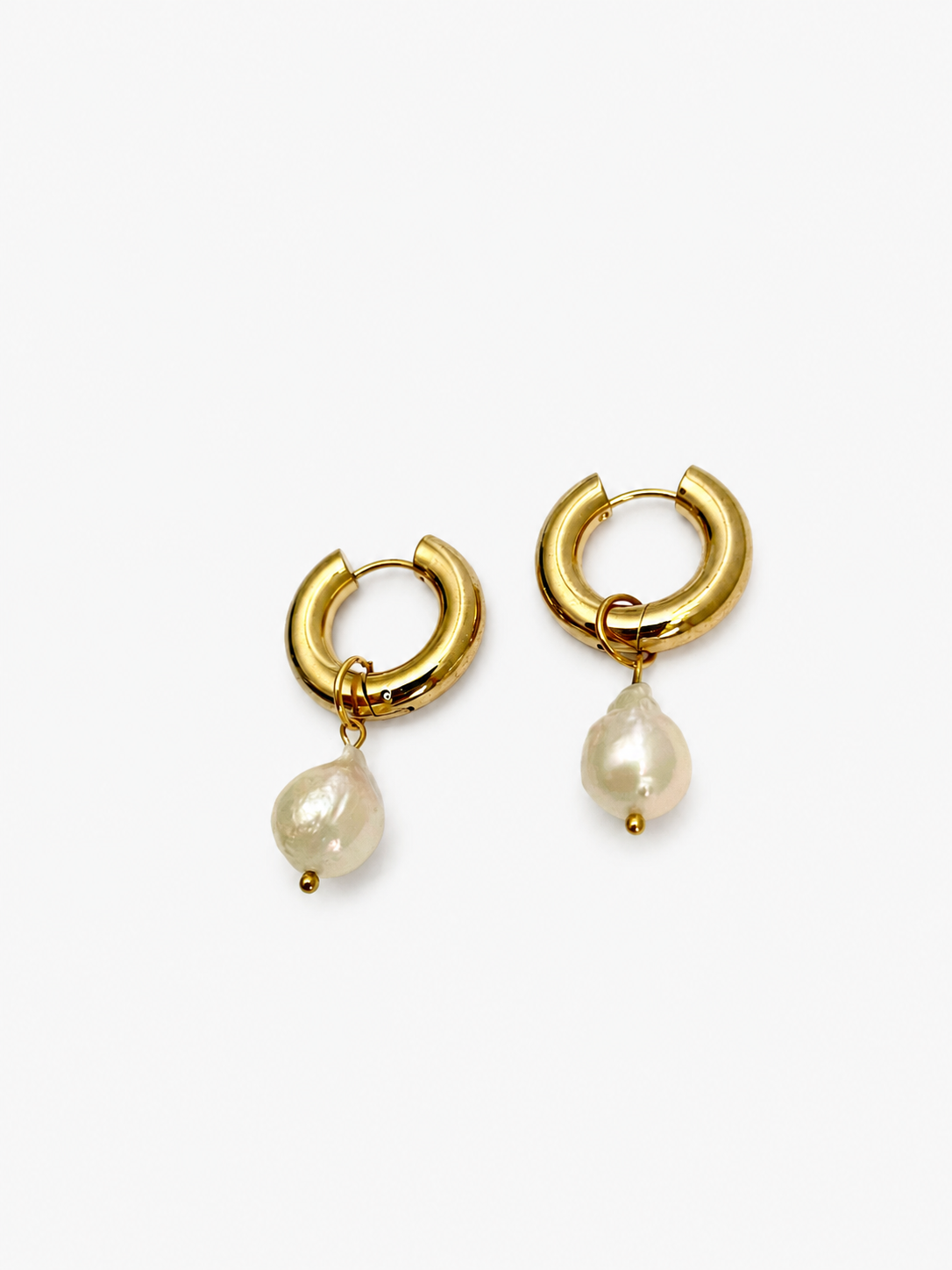 Pair of chunky gold hoop earrings with 13 mm white baroque freshwater pearl drops.