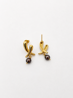Back and angled view of gold cross stud earrings with dark baroque freshwater pearl drops and stud posts