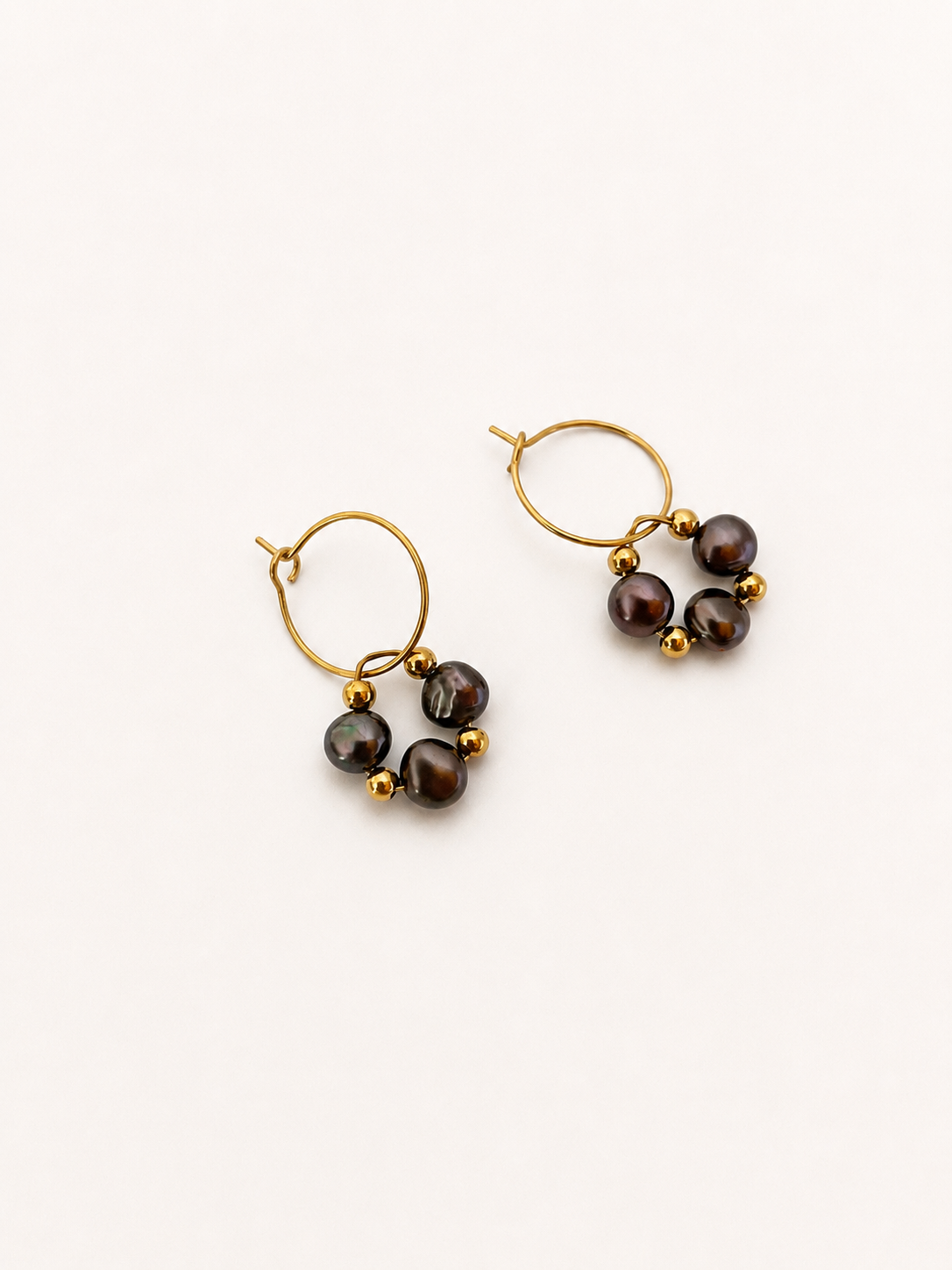 Pair of gold hoop earrings with 4 mm dark baroque freshwater pearls and polished gold bead accents