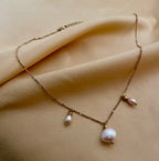 Gold baroque pearl necklace. Dainty gold chain jewelry with iridescent white pearls and organic shapes