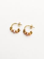 Pair of gold creole hoop earrings with 4 mm pink and gold baroque freshwater pearls and polished gold beads.