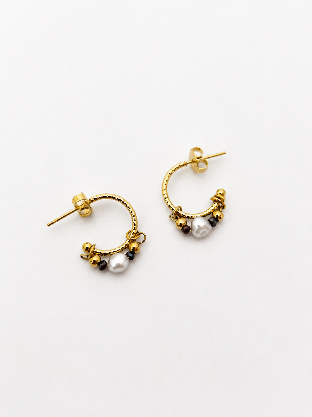 Pair of gold creole hoop earrings with light grey baroque and dark grey Keshi freshwater pearls