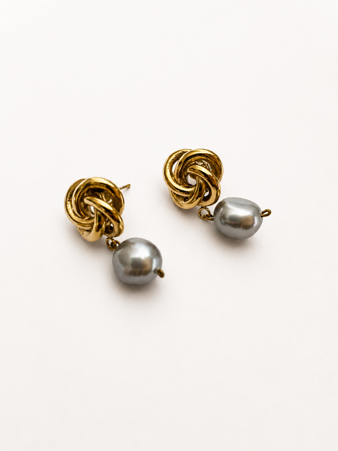 Pair of gold Celtic knot drop earrings with 10 mm grey baroque freshwater pearl drops.