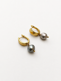 Pair of gold huggie hoop earrings with 10 mm grey baroque freshwater pearl drops.