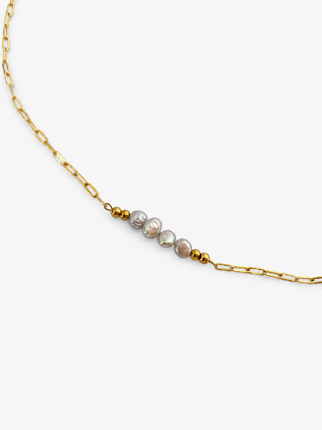 Gold elongated-link necklace with four grey baroque freshwater pearls framed by polished gold beads