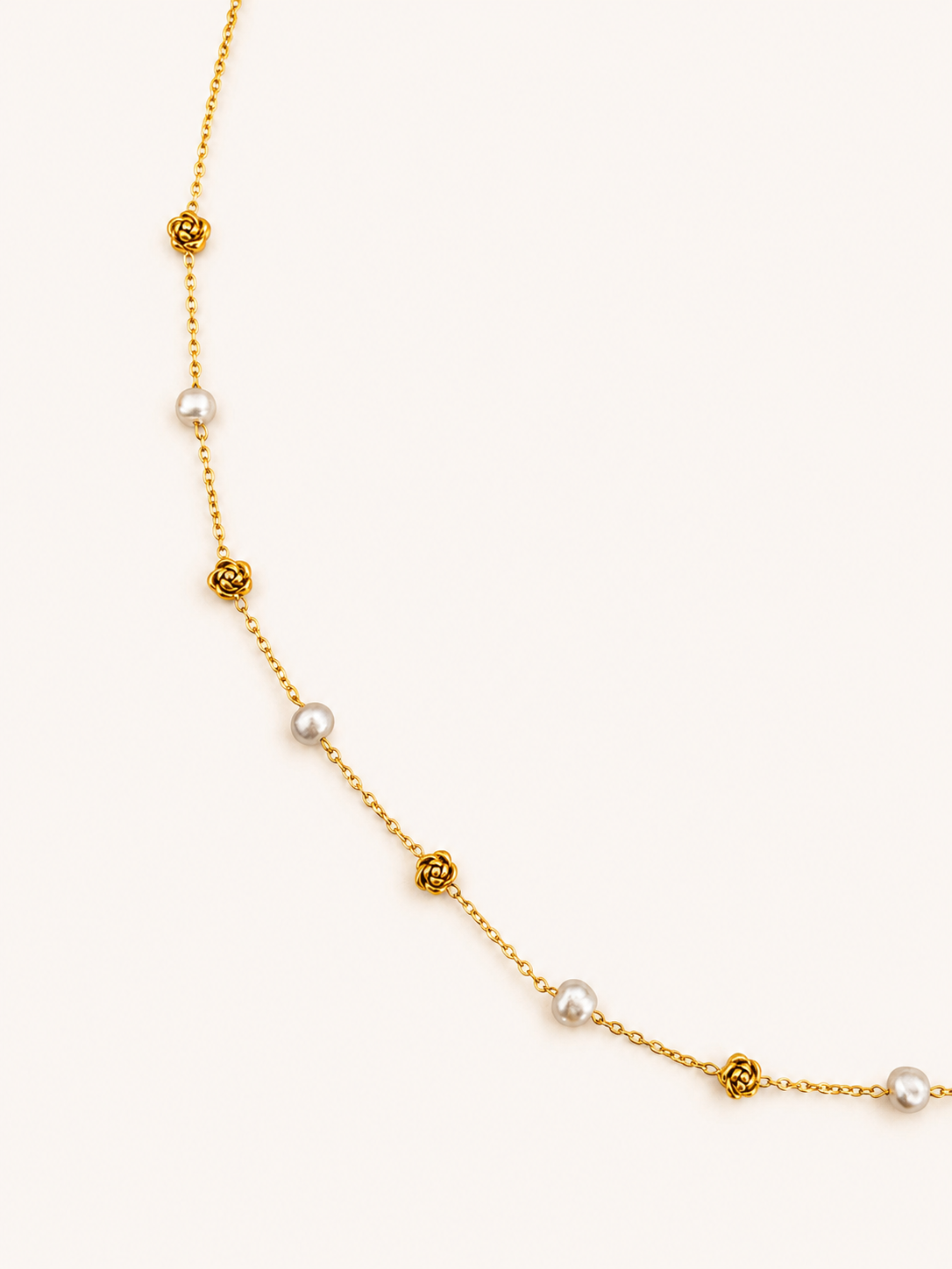 Gold station necklace with 4 mm grey baroque freshwater pearls alternating with sculpted rose details