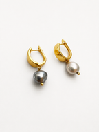Front view of gold huggie hoop earrings with organic grey baroque freshwater pearl drops