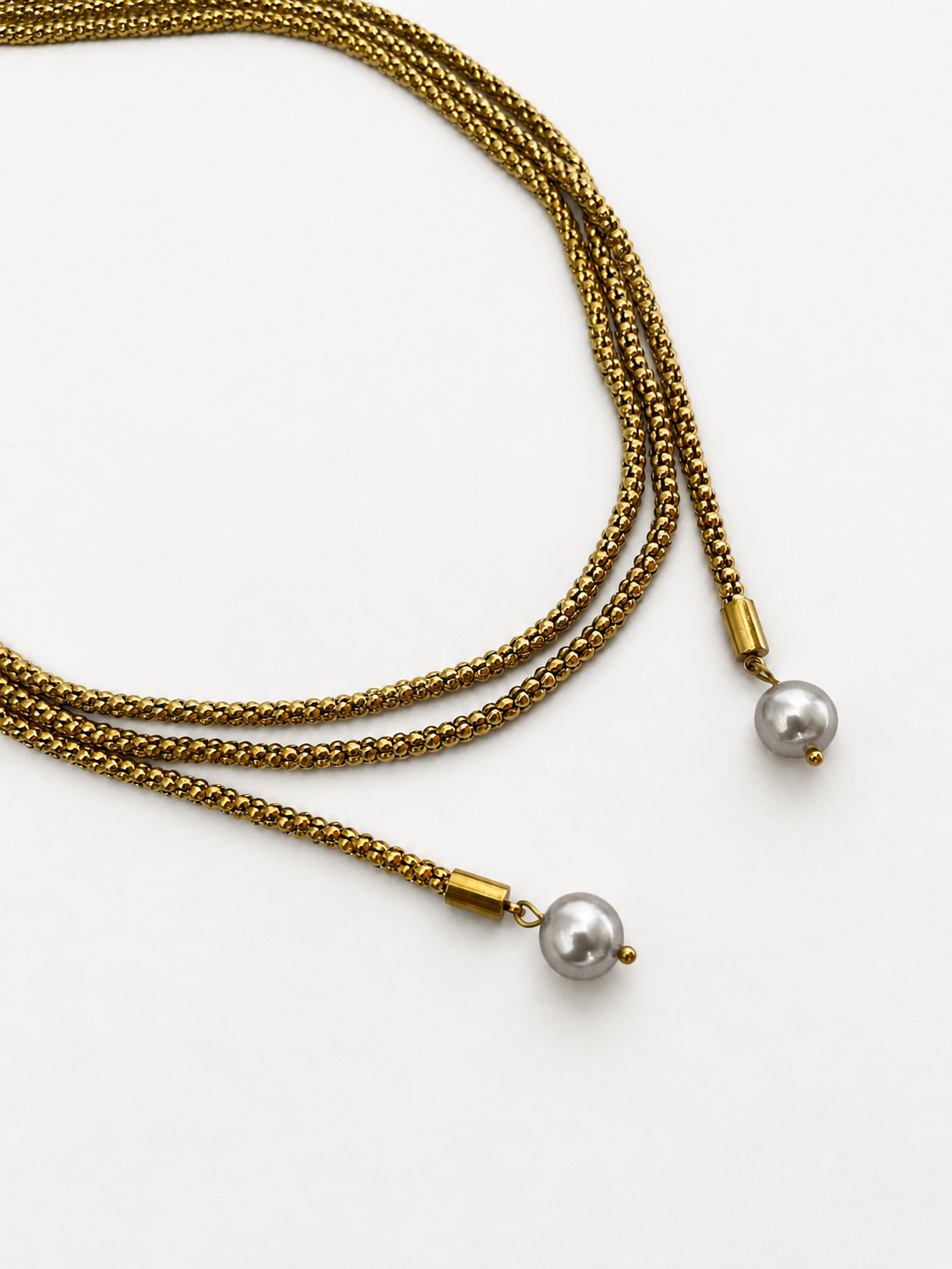 Gold open beaded necklace with two 10 mm grey baroque freshwater pearl drops.