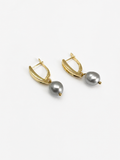 Pair of gold pandan leaf drop earrings with 10 mm grey baroque freshwater pearls.