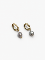 Pair of gold pebble drop earrings with 10 mm grey baroque freshwater pearls.