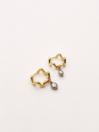 Pair of wave-inspired gold creole hoop earrings with 4 mm grey baroque freshwater pearl drops.