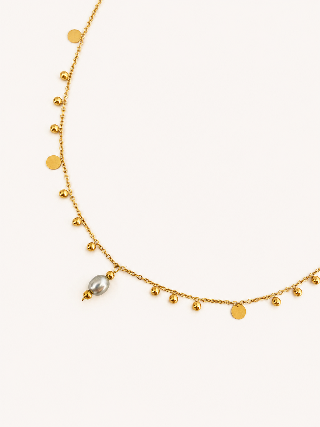 Gold bead charms necklace with polished disc accents and a 6 mm oval light grey freshwater pearl pendant
