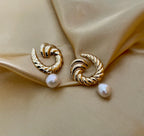 Close-up detail of the ribbed gold texture on the Miranda croissant hoops paired with a high-lustre AAA white baroque pearl.