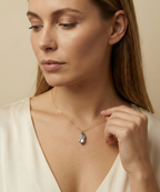 Organic grey baroque pearl necklace featuring a high-luster Keshi pearl suspended on a fine gold chain. Minimalist jewelry styling