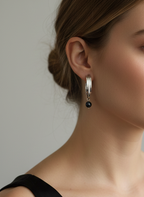 Naomi gold drop earrings featuring a sleek 3cm linear gold bar ending in a round 7mm black freshwater pearl. Minimalist 18k gold plated jewelry