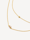 Gold double-layer necklace with a 4 mm pink freshwater pearl and polished gold bead accents