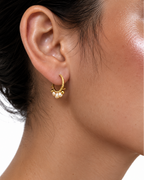 Side view of gold  keshi pearl creole earrings in waterproof 18k gold-plated stainless steel