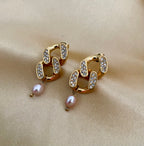 Gold hoop earrings with pink freshwater pearl drops