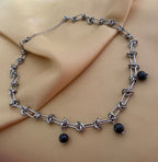 silver knotted link chain necklace featuring three round black pearl charms