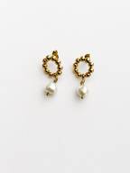 Pair of gold beaded drop earrings with 10 mm white baroque freshwater pearls.