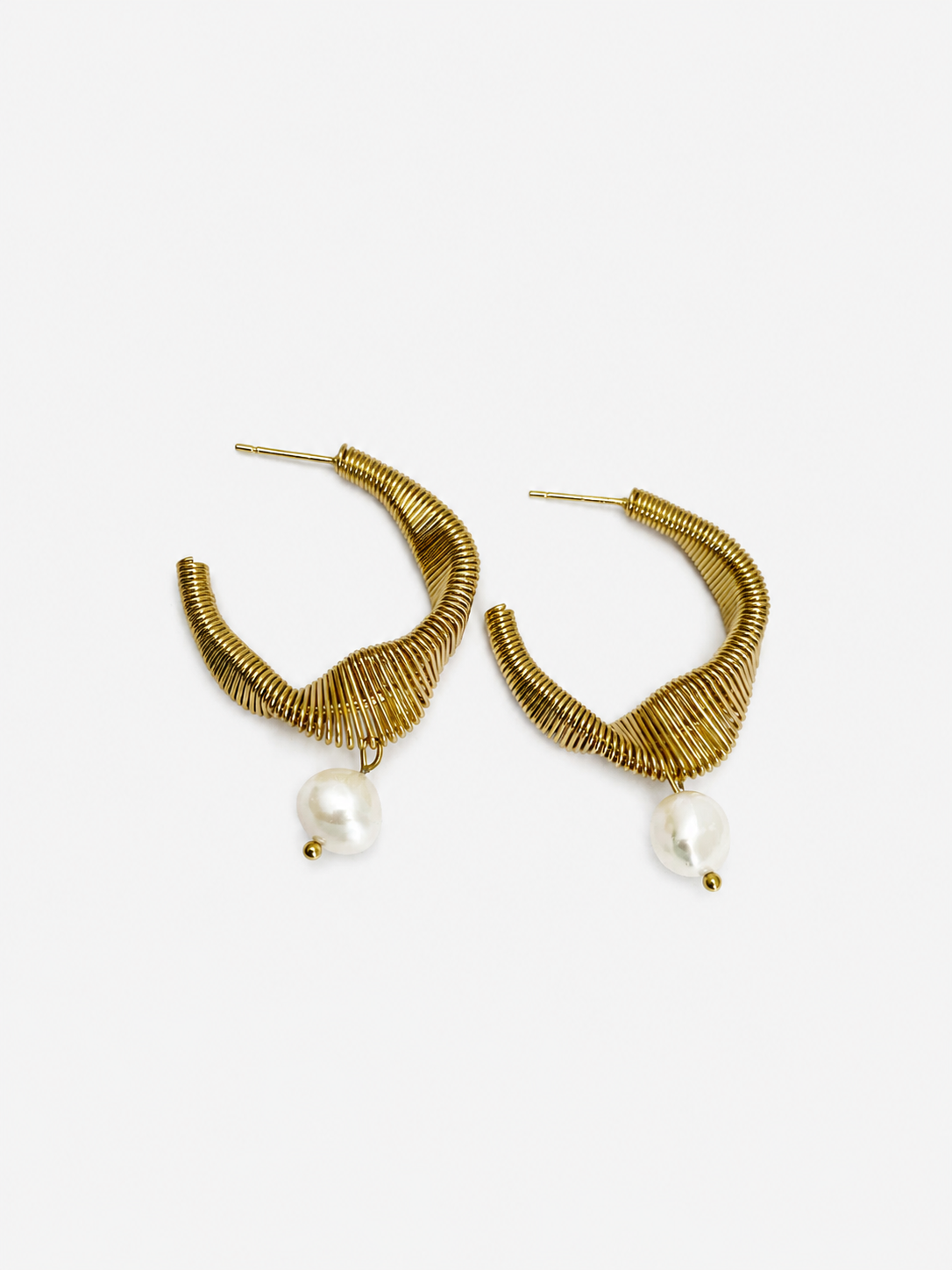 Pair of sculptural coiled gold demi-hoop earrings with 10 mm white baroque freshwater pearl drops