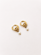 Pair of sculptural gold double-hoop earrings with 6 mm white baroque freshwater pearl drops