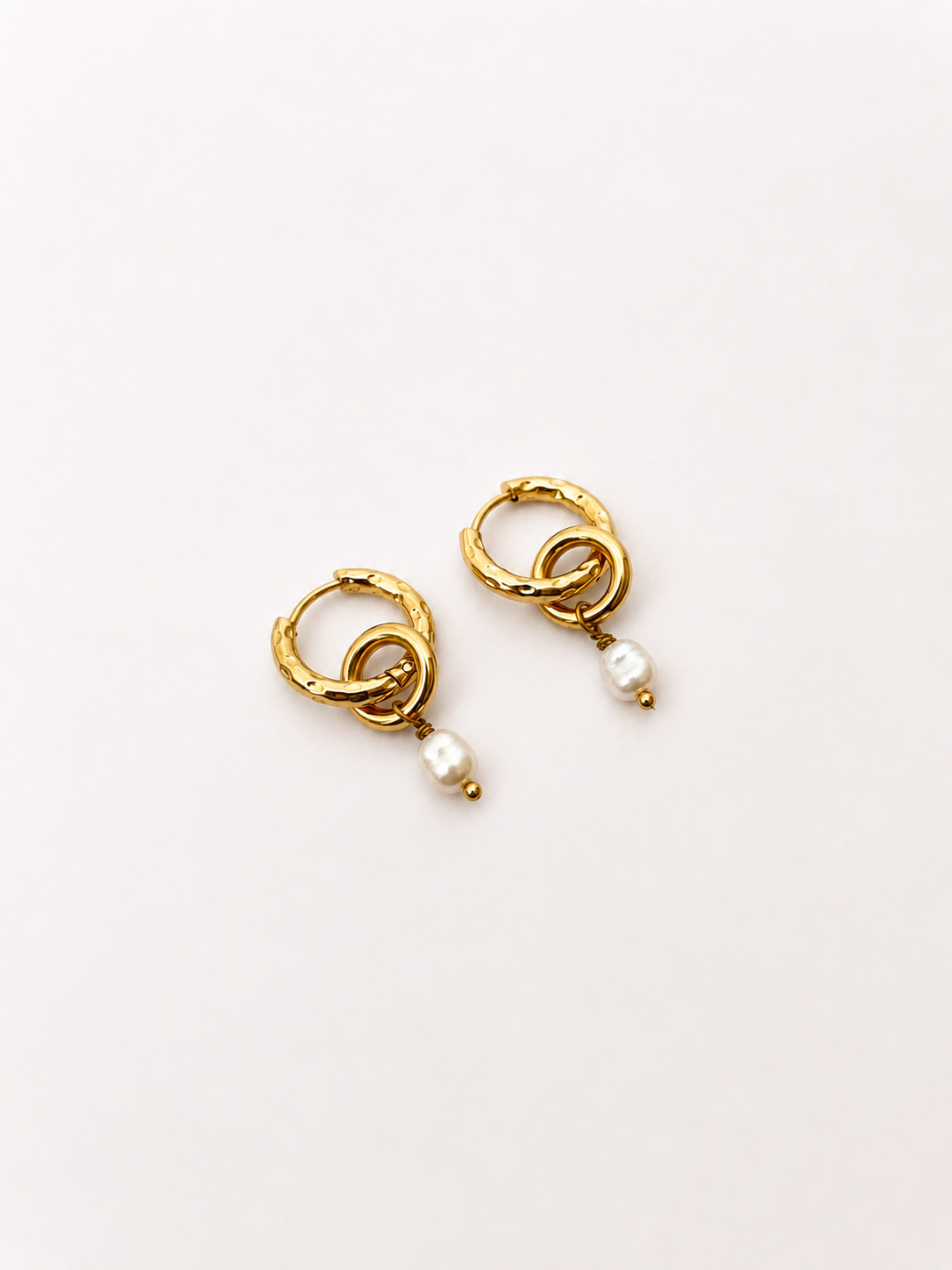 Pair of sculptural gold double-hoop earrings with 6 mm white baroque freshwater pearl drops