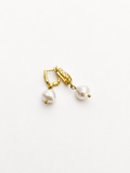 Pair of gold drop earrings with 10 mm white baroque freshwater pearl pendants.