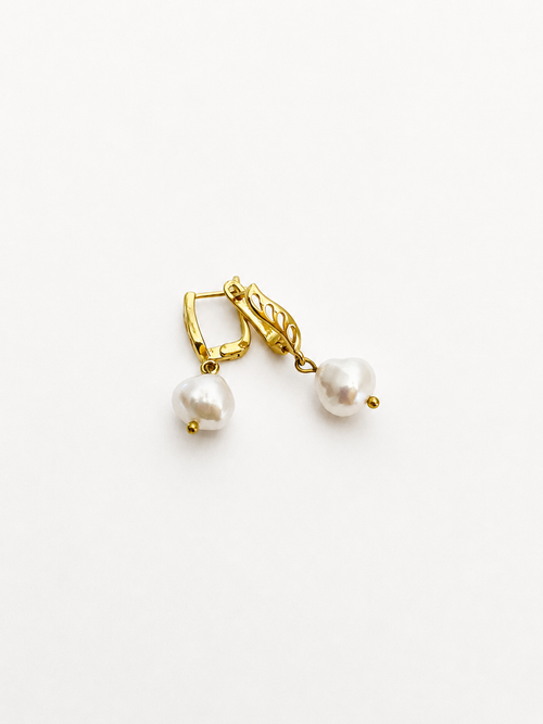 Pair of gold drop earrings with 10 mm white baroque freshwater pearl pendants.