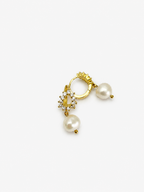 Back and angled view of gold halo drop earrings with white baroque freshwater pearl pendants