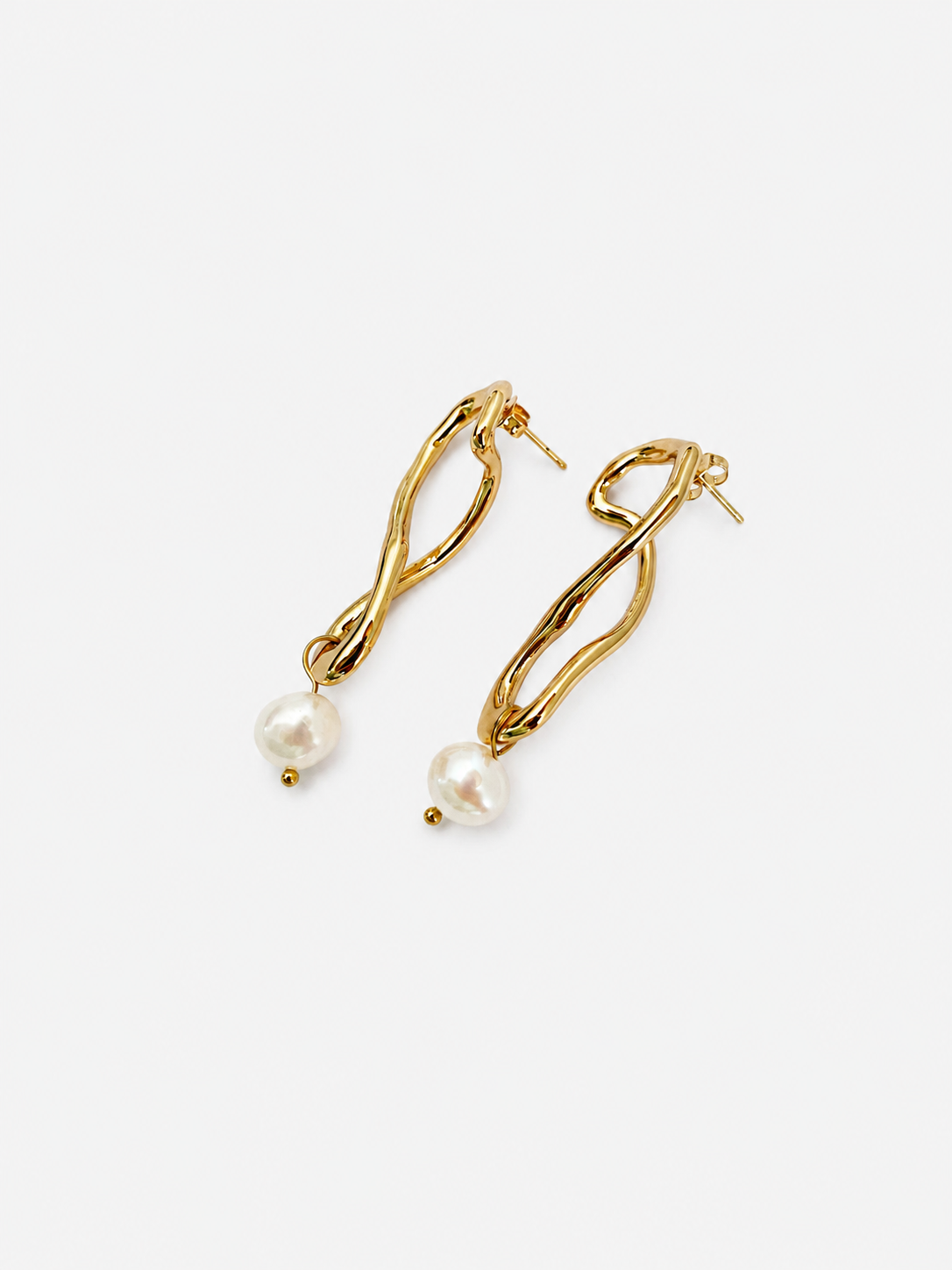 Back view of gold knot drop earrings with posts and white baroque freshwater pearl pendants
