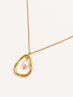 Gold molten-inspired pendant necklace with a 10 mm white baroque freshwater pearl on a delicate chain