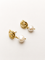 Pair of gold Nordic knot drop earrings with 10 mm white baroque freshwater pearl drops