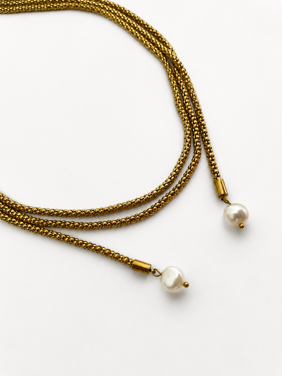 Gold open beaded necklace with two 10 mm white baroque freshwater pearl drops.