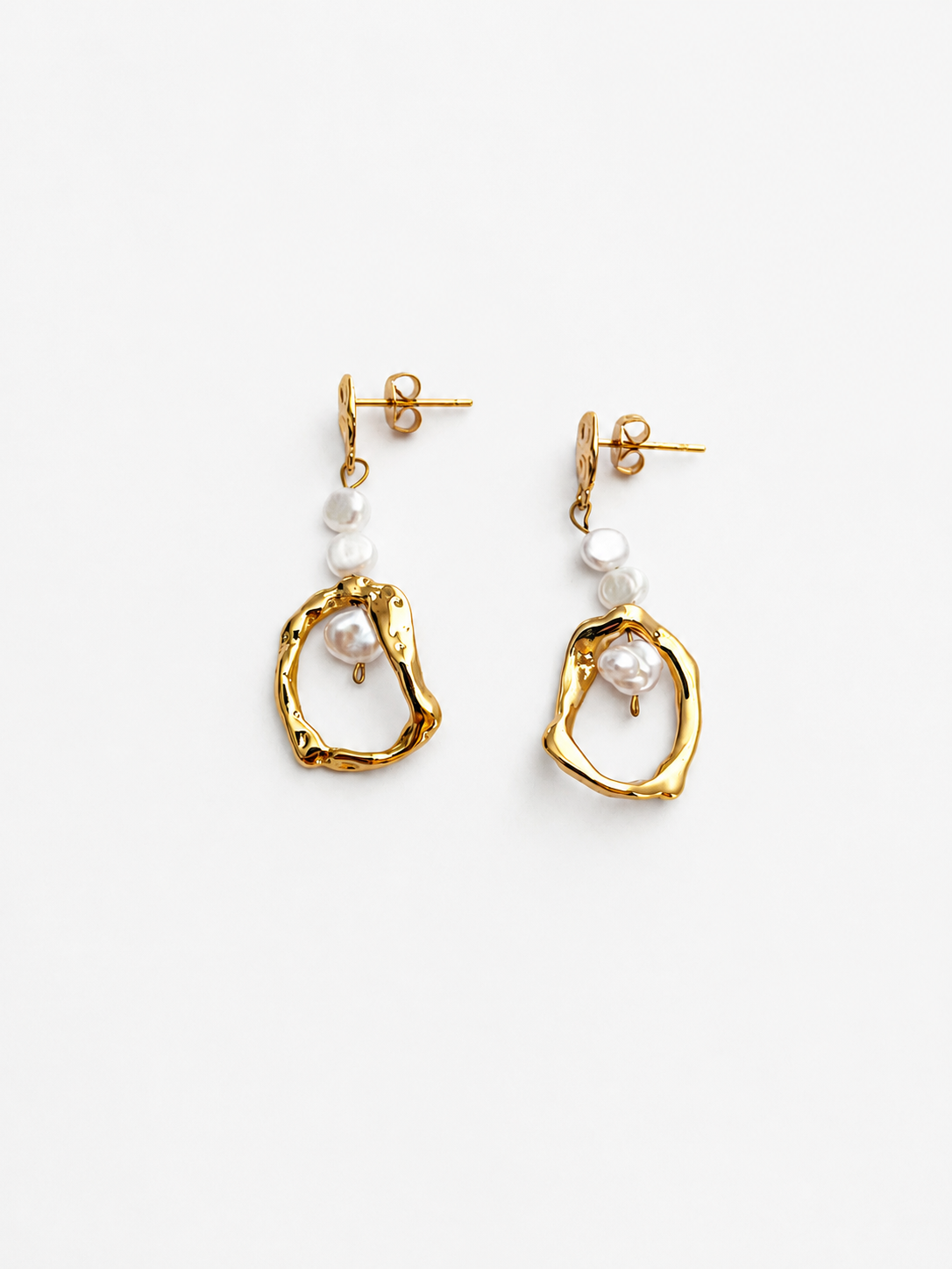 Pair of sculptural gold organic droplet earrings with 4 mm white baroque freshwater pearls.