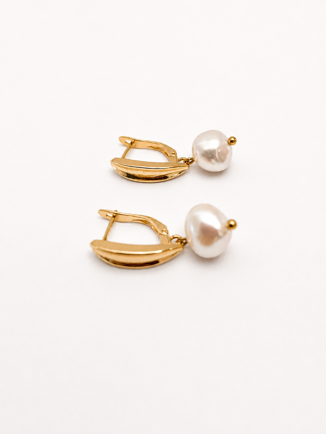 Pair of gold pandan leaf drop earrings with 10 mm white baroque freshwater pearls