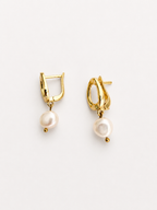 Pair of sculptural gold pebble drop earrings with 10 mm white baroque freshwater pearls.