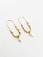 Pair of gold paperclip drop earrings with 5 mm oval white freshwater pearl pendants