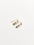 Pair of gold ear climber earrings with 4 mm white and grey baroque freshwater pearls.