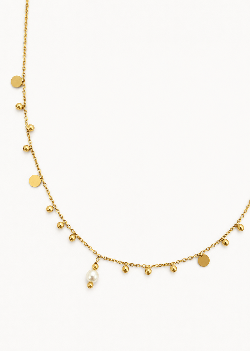 Gold bead charms necklace with a 6 mm oval white freshwater pearl, polished beads and disc charms.