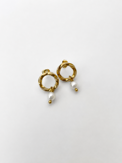 Pair of textured gold circle drop earrings with 6 mm oval white freshwater pearls